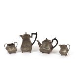 An Art Deco spot hammered pewter four piece coffee