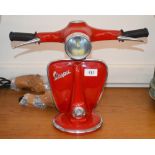 A novelty lamp in the form of a red Vespa scooter,