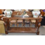 An early 20th Century oak two tier serving table,