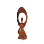 A Barbara Hepworth style carved treen figure