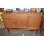 A teak G plan design sideboard, fitted with a shal