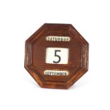 A vintage wall mounted wooden calendar