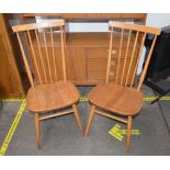 A pair of light elm Ercol type stick back kitchen