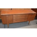 A teak G plan style sideboard, fitted three centra