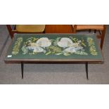 A 1960's coffee table with embroidered top