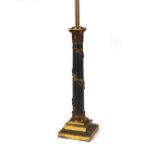 A brass and enamel table lamp with vine leaf decor