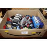 A box of various die-cast toys