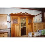 A late Victorian satin walnut triple wardrobe