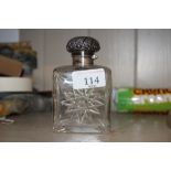 A square cut glass scent bottle with silver mounts