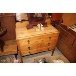 A light oak three drawer chest