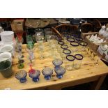 A quantity of various drinking glasses, blue glass