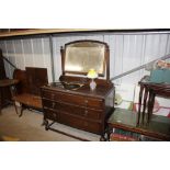 An oak three drawer dressing chest