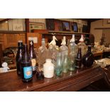 Four various glass soda syphons and old glass bott