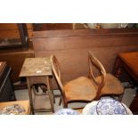 An oak two tier plant stand; and a pair of Victori