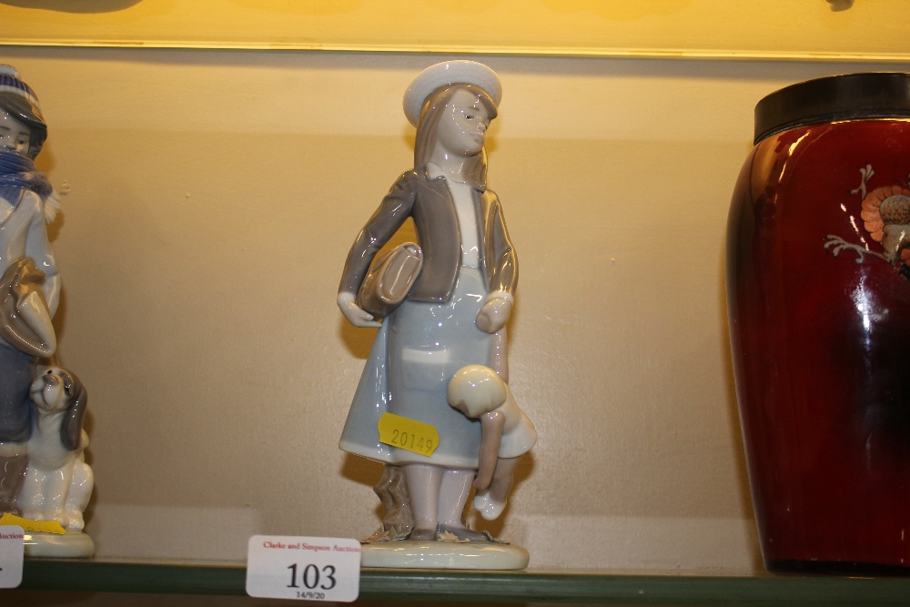 A Lladro porcelain figurine of a young girl with s