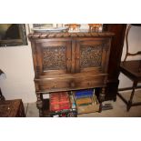 A good quality oak side cupboard fitted two drawer