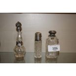 Three glass silver and white metal mounted scent b