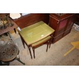 Two mahogany occasional tables with green leather