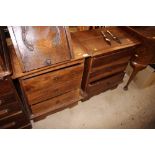 A pair of hardwood three drawer bedside chests