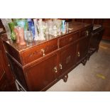 A 20th Century oak sideboard fitted three drawers