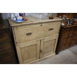 A 19th Century stripped pine secretaire with cupbo