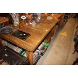 An Art Deco walnut extending dining table with two