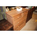 A modern stripped pine chest fitted two short over