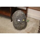 A large carved stone Buddhas head