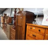 An oak single door cupboard