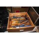 A box of various hand tools