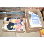 Three boxes of textiles and dolls