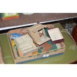 A box of toys and dolls house furniture