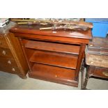 A reproduction mahogany open fronted bookcase