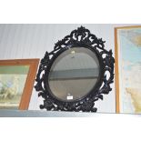 A black framed wall mirror