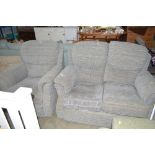 A two seater settee with matching armchair