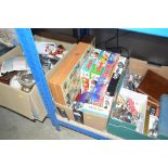 A box of various games and puzzles
