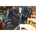 A black faux leather upholstered office chair