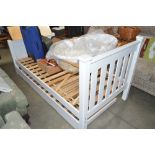 A single bed frame with trundle bed