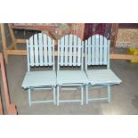 A set of three teak blue painted folding garden ch