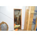 A teak framed oblong wall mirror