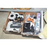 Two boxes of various game consoles to include, Pl