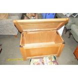 A light oak blanket box