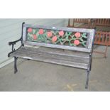 A teak and metal garden bench