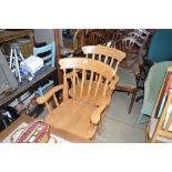 A pair of beech slat back carver chairs