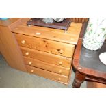 A modern pine chest fitted four long drawers