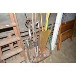 A quantity of long handled gardening tools; fire s