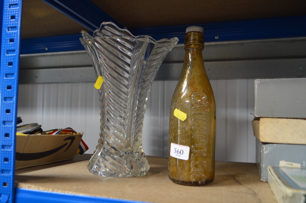 A glass vase and an old glass bottle and stopper