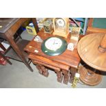 A nest of three hardwood occasional tables