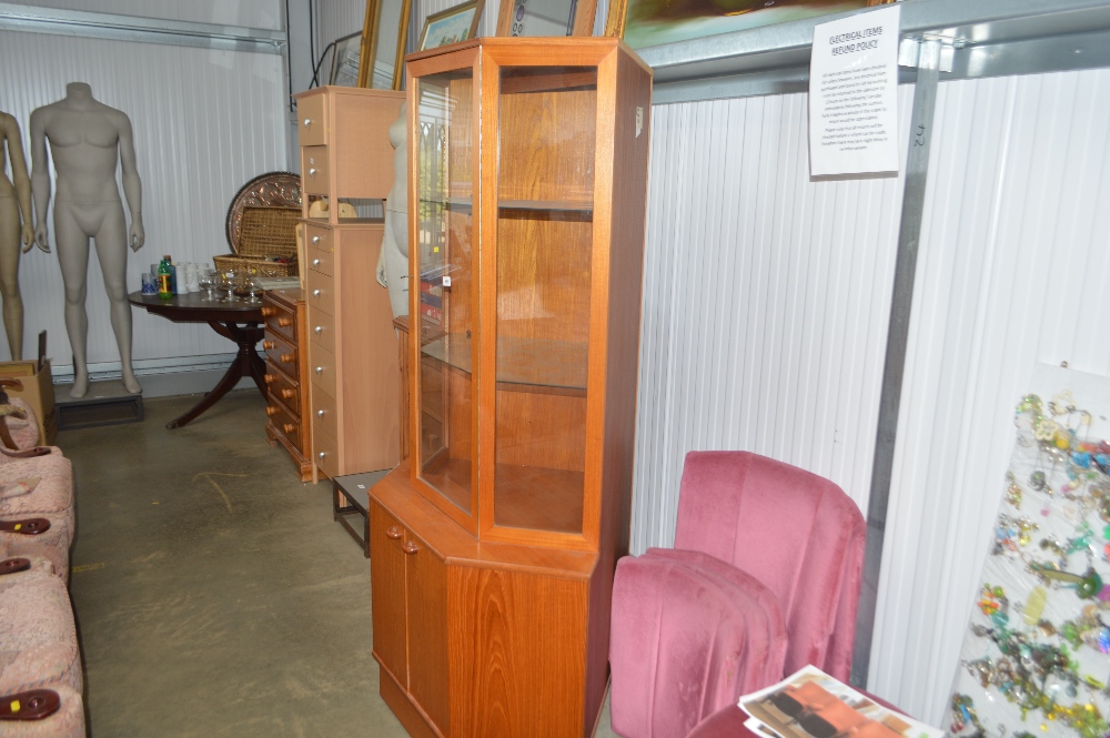 A glazed corner cabinet