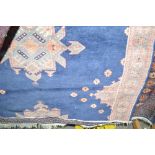 An approx 5' x 4' floral patterned wool rug
